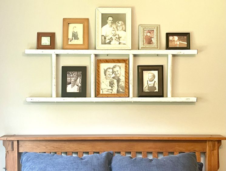 Old photos displayed a on a ladder.